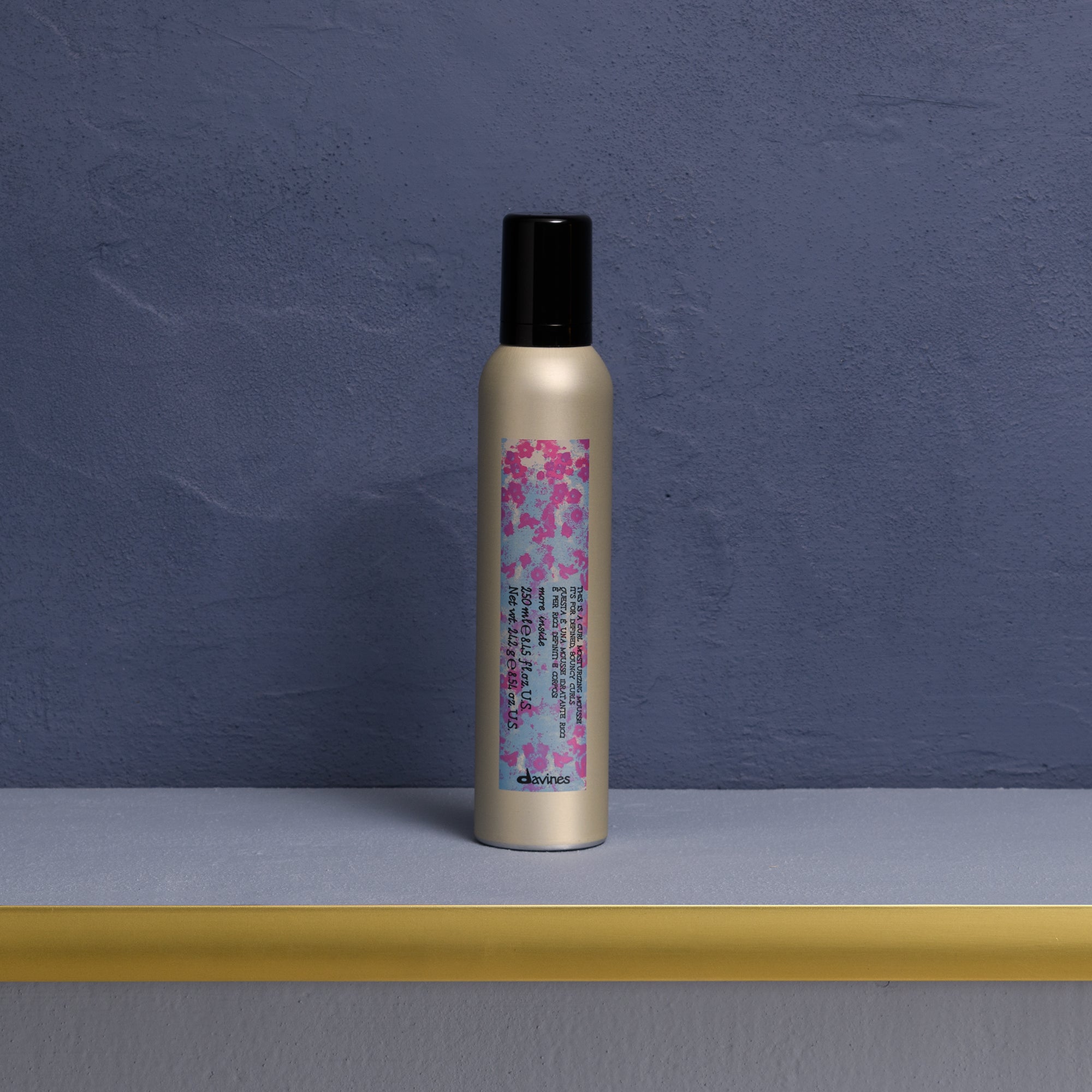 Davines This is a Curl Moisturizing Mousse - For adding a hydrating and defining boost to curls.
