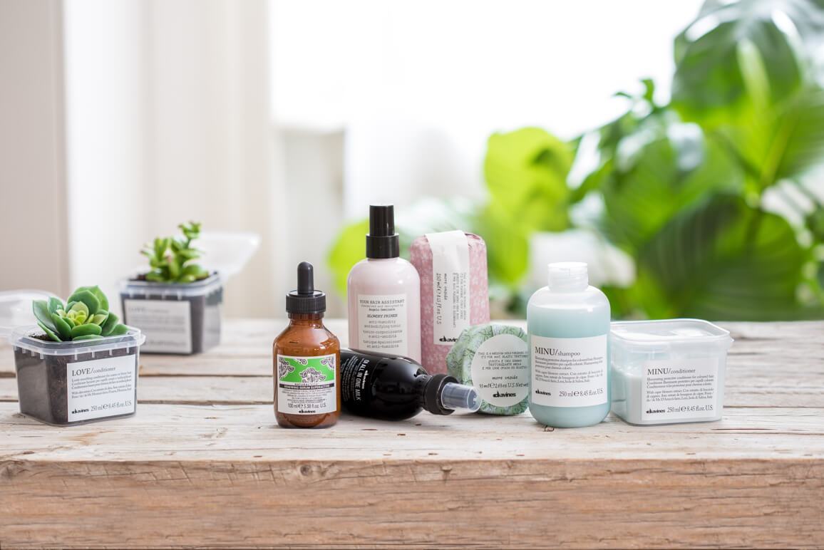 davines hair products sitting on a wooden table