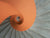 image of an orange and grey spiral staircase